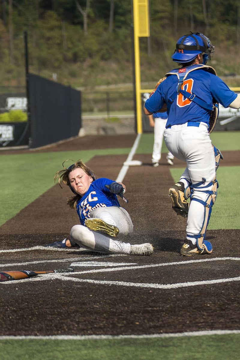 Ashton Lansdell, the only female to play on the Georgia Highlands College baseball team, slides safely into home base during a baseball intrasquad scrimmage at the Lakepoint Sports Complex in Emerson on Sept. 26, 2019. ALYSSA POINTER / ALYSSA.POINTER@AJC.COM