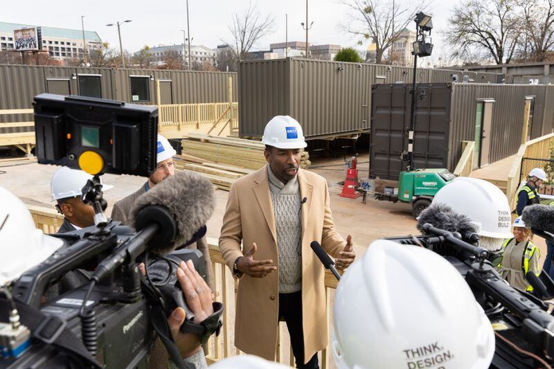 Atlanta Mayor Andre Dickens gives a press conference following a tour of 184 Forsyth Street, a development of shipping containers repurposed into housing for unhoused people, in Atlanta on Friday, December 22, 2023. (Arvin Temkar / arvin.temkar@ajc.com)