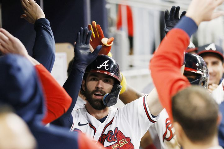 Braves shortstop Dansby Swanson (7) gets high fives after hitting a two-run home run during the fifth inning of a baseball game against the New York Mets at Truist Park on Saturday, Oct. 1, 2022. Miguel Martinez / miguel.martinezjimenez@ajc.com