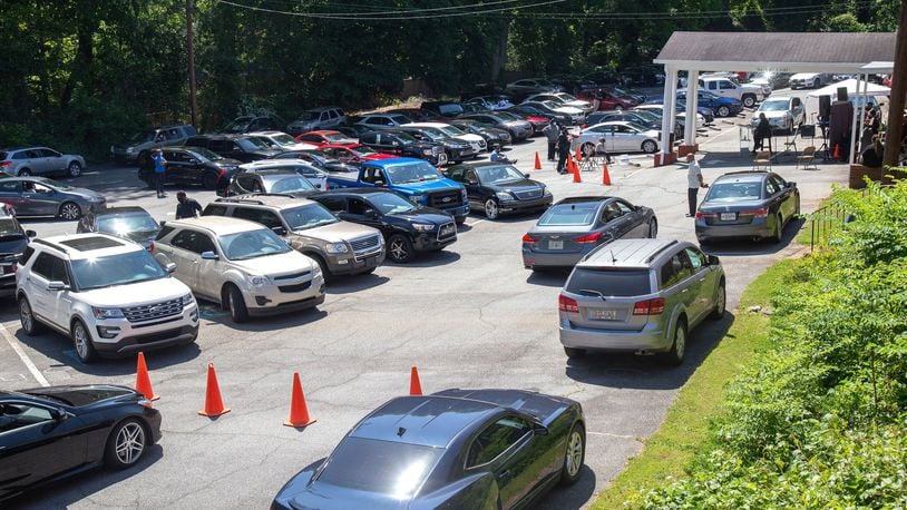 Cars fill the back parking lot of the New Beginning Full Gospel Baptist Church in Decatur during their drive-in Sunday service, May 3, 2020. STEVE SCHAEFER / SPECIAL TO THE AJC