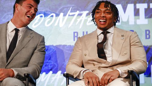Georgia Tech running back Dontae Smith, right, and tight end Dylan Leonard laugh as the sit on stage at the NCAA college football Atlantic Coast Conference Media Days in Charlotte, N.C., Thursday, July 21, 2022. (AP Photo/Nell Redmond)
