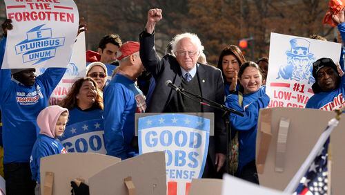 Sen. Bernie Sanders joins striking federal contract workers during their rally to hold President-elect Donald Trump accountable to keeping his promise to workers Dec. 7, 2016 in Washington, D.C. (Olivier Douliery/Abaca Press/TNS)
