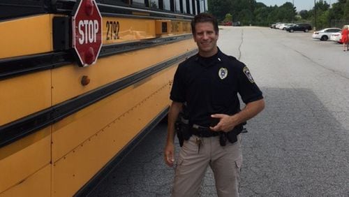 Lt. Tony Lockard of Gwinnett County Schools Police Department shows one of the county’s 300 buses that have stop arm cameras. Doug Turnbull/WSB