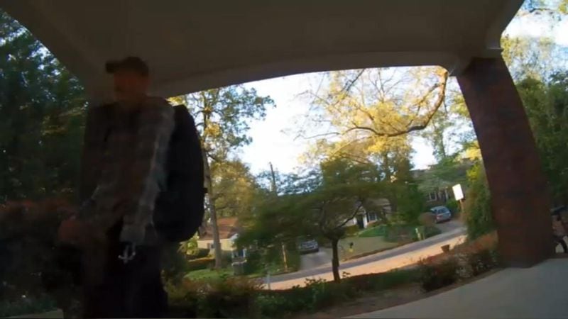 Surveillance video caught a man with a hook for a left hand stealing packages in northwest Atlanta. (Credit: Channel 2 Action News)