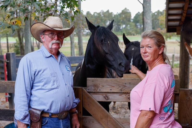 Jimmy and Libby Wilcher pose for a portrait at their farm near the town of Mitchell on Wednesday, October 12, 2022. (Arvin Temkar / arvin.temkar@ajc.com)
