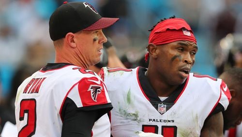 Falcons wide receiver Julio Jones and quarterback Matt Ryan react on the sidelines after Jones dropped a certain touchdown pass in the end zone during the fourth quarter against the Panthers in a NFL football game on Sunday, November 5, 2017, in Charlotte. The Panthers held on to beat the Falcons 20-17.   Curtis Compton/ccompton@ajc.com