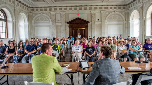 Author Jamie Brickhouse (left) is introduced to the crowd by John Lemley during the AJC Decatur Book Festival on Saturday, September 5, 2015. The DBF the largest independent book festival in the country and one of the five largest overall. Since its launch, more than 1,000 world-class authors and hundreds of thousands of festival-goers have crowded the historic downtown Decatur square to enjoy book signings, author readings, panel discussions, an interactive children's area, live music, parades, cooking demonstrations, poetry slams, writing workshops, and more. JONATHAN PHILLIPS / SPECIAL