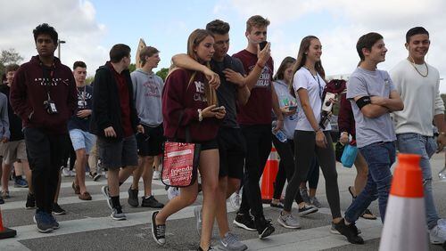 PARKLAND, FL - FEBRUARY 28:  Students leave Marjory Stoneman Douglas High School after attending their classes for the first time since the shooting that killed 17 people on February 14 at the school on February 28, 2018 in Parkland, Florida.  Police arrested 19-year-old former student Nikolas Cruz for the 17 murders.  (Photo by Joe Raedle/Getty Images)