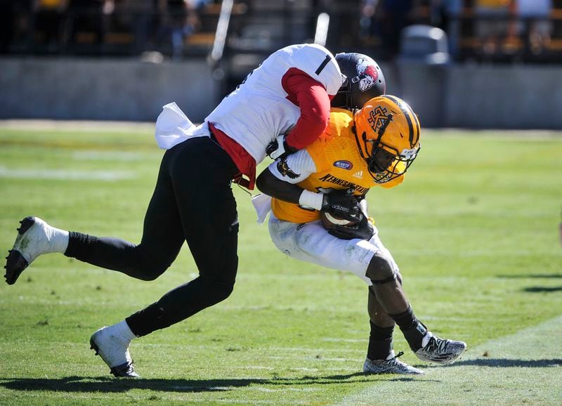 Kennesaw State running back Chasten Bennett is forced out of bounds by Gardner-Webb corner back Ivan Toomer during the second half of an NCAA college football game, Saturday, Oct. 17, 2015, in Kennesaw, Ga. Kennesaw State won 12-7. (Photo/John Amis)