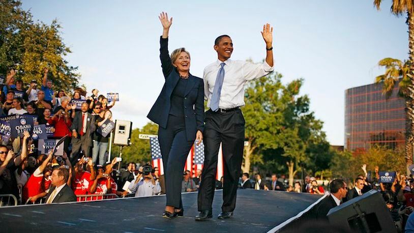 FILE -- Then Senators Barack Obama and Hillary Clinton at a presidential campaign rally, after Obama had clinched the Democratic nomination, at Amway Arena in Orlando, Fla., Oct. 20, 2008. Advisers say that Obama, who sees a Democratic successor as critical to his legacy, is impatient to begin campaigning for Hillary Clinton, and will soon formally endorse her candidacy. (Damon Winter/The New York Times)