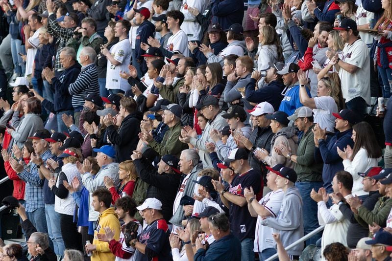 Fans cheer before a game between the Atlanta Braves and Cincinnati Reds at Truist Park on Thursday, April 7, 2022, in Atlanta.  Branden Camp/For the Atlanta Journal-Constitution
