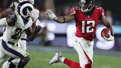 Falcons wide receiver Mohamed Sanu makes a long first down reception on a touchdown drive against the Rams during the fourth quarter in their NFL Wild Card Game on Saturday, January 6, 2018, in Los Angeles.    Curtis Compton/ccompton@ajc.com