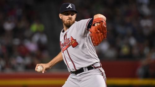 Kevin Gausman  of the Atlanta Braves delivers a pitch against the Arizona Diamondbacks. (Photo by Norm Hall/Getty Images)