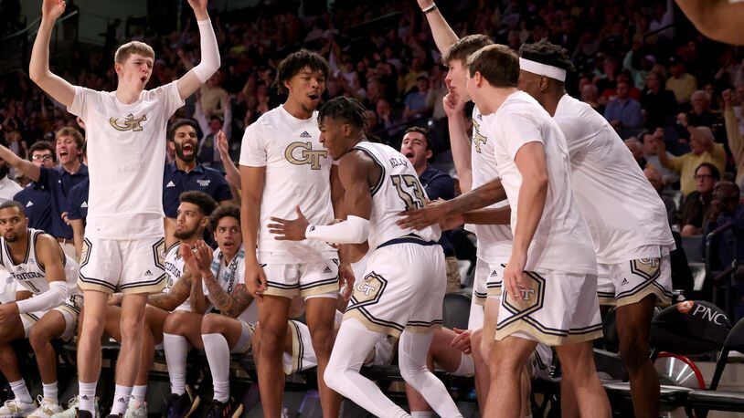 Georgia Tech Yellow Jackets guard Miles Kelly (13) reacts with players on the bench after he made a three-point basket during the second half against the Georgia Bulldogs at McCamish Pavilion, Tuesday, December 6, 2022, in Atlanta. (Jason Getz / Jason.Getz@ajc.com)