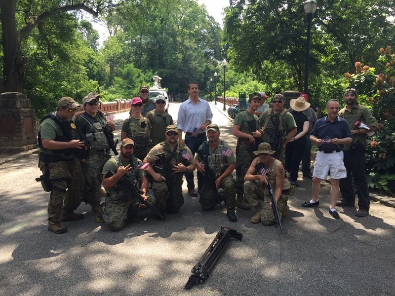 A Georgia militia known as the III% Security Force were photographed in Piedmont Park June 10 at an anti-Muslim rally with GOP candidate for governor Michael Williams, center. Michael Ramos, who was identified on social media as participating in violence in Charlottesville, Va., is at far right cradling a bullhorn. A leader of the militia group said Ramos was no longer a part of his group when the photo was taken but had attended the rally as “an activist.”