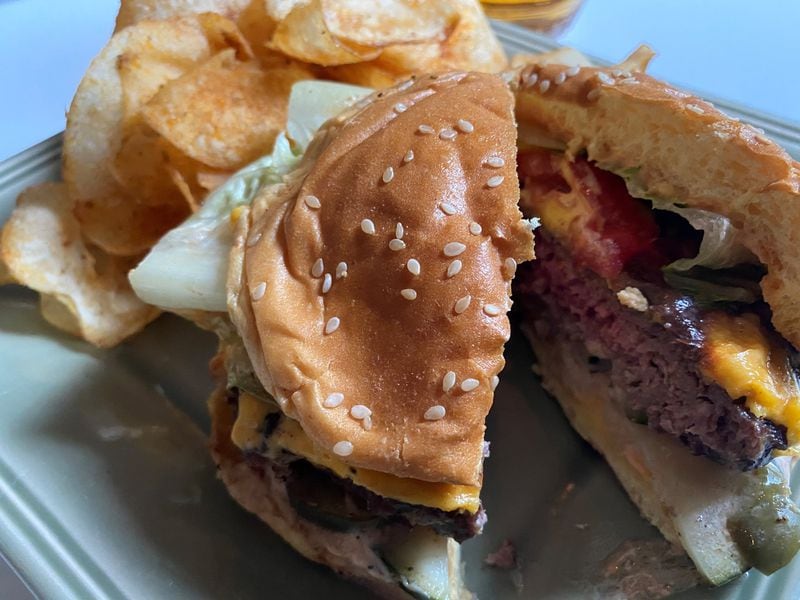 The Boxcar Classic burger is made with local beef, American cheese, tomatoes, lettuce, shaved onion and special sauce. Here, it’s served with Old Bay chips. CONTRIBUTED BY BOB TOWNSEND