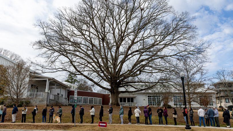 Voters wait in line at Milton Library in Milton on the last day of early voting on Friday, December 2, 2022.   (Arvin Temkar / arvin.temkar@ajc.com)