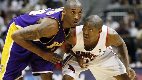The Lakers' Kobe Bryant and the Hawks' Jamal Crawford battle for position in a 2010 game.  Curtis Compton ccompton@ajc.com