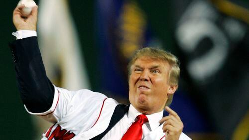 Donald Trump throws out the ceremonial first pitch before the start of a 2006 game between the Boston Red Sox and the New York Yankees at Fenway Park in Boston.