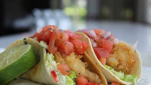 Take a bite out of fish tacos, which are two for $5 at Savor Bar & Kitchen today. Photo credit: M-Squared Public Relations.