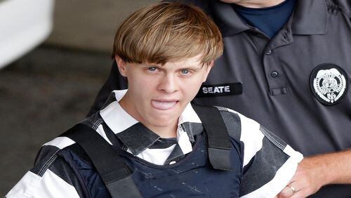 In this Thursday, June 18, 2015, file photo, Charleston, S.C., shooting suspect Dylann Storm Roof is escorted from the Cleveland County Courthouse in Shelby, N.C.