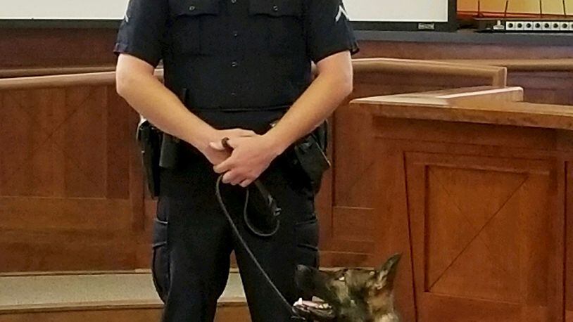 Officer Josh Riviere introduced his new K-9 partner, Finn, at the Fayetteville City Council meeting on Aug. 17. Courtesy Fayetteville Police Department