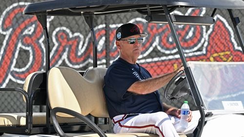 Braves manager Brian Snitker drives a cart around during Braves spring training at CoolToday Park, Thursday, Feb. 16, 2023, in North Port, Fla.. (Hyosub Shin / Hyosub.Shin@ajc.com)