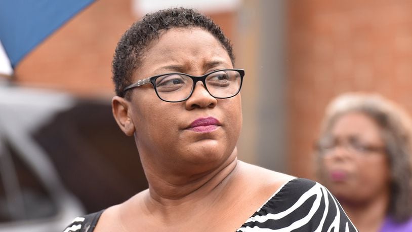 Tamara Cotman, who was convicted in the Atlanta Public Schools test-cheating case, reacts before she turns herself in outside the Fulton County Jail in Atlanta on Tuesday, October 9, 2018. AJC file photo. HYOSUB SHIN / HSHIN@AJC.COM