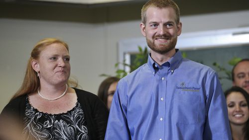 EBOLA VICTIM GOES HOME--August 21, 2014 Dekalb County: Dr. Kent Brantly stood with his wife Amber and made a statement at Emory University Hospital annex following his discharge from the facility after being successfully treated for Ebola Thursday, Aug. 21, 2014. Bruce Ribner, MD, medical director of Emory's Infectious Disease Unit, discussed the discharge of Brantly and the discharge of patient, missionary Nancy Writebol, who also had contracted the Ebola virus. JOHN SPINK/JSPINK@AJC.COM