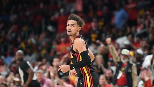 Hawks guard Trae Young reacts after scoring during the first half in Game 4. Young finished with nine points in Atlanta's 110-86 loss. (Hyosub Shin / Hyosub.Shin@ajc.com)
