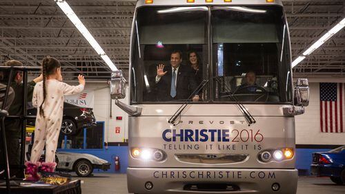 Republican presidential hopeful and New Jersey Gov. Chris Christie arrives at a campaign event by having his bus driven into a garage at Nashua Community College on Monday in Nashua, N.H. Andrew Burton/Getty Images