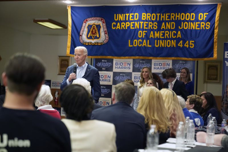 President Joe Biden speaks at the Carpenters Union Hall on Tuesday in  Scranton, Pa. Today he meets with members of the United Steelworkers at their headquarters in Pittsburgh.