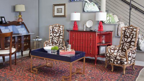 Besides tabletop treats, Steve McKenzie’s offers home furnishings, such as this red chest by Grange Furniture in France, a coffee table by Worlds Away, and the foo dog lamps by Barbara Cosgrove. Contributed by Christina Wedge