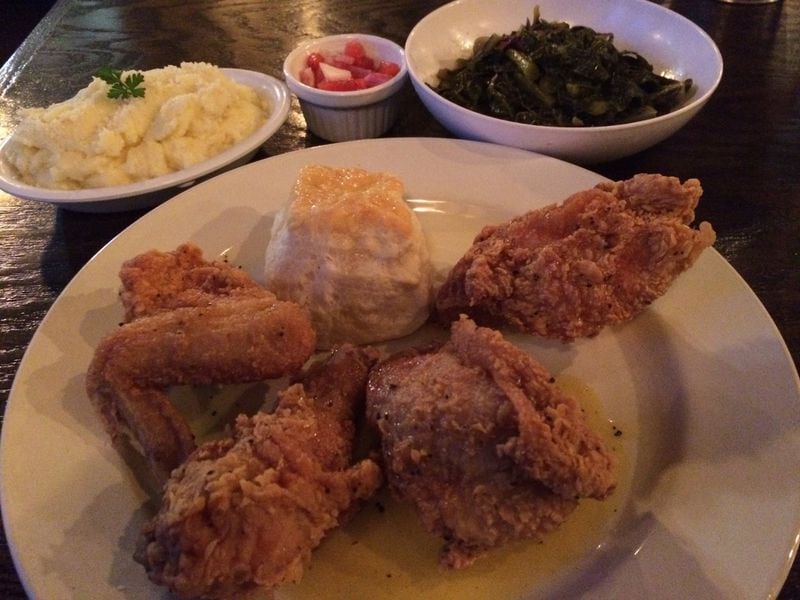 The Lemon Pepper Honey Fried Chicken at Greens & Gravy in Westview is among the best fried bird in the city. It is shown here with sides of Parmesan mashed potatoes and braised collards with smoked turkey. The greens come with a little ramekin of watermelon chowchow. CONTRIBUTED BY WENDELL BROCK