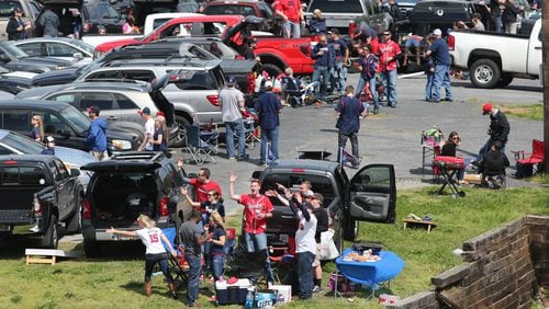 Fans tailgate at the Braves home opener at Turner Field Tuesday afternoon, April 8, 2014.