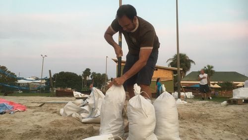 Adam Demico hurried to fill sandbags ahead of Hurricane Irma's approach.