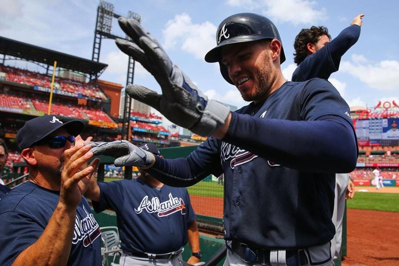 Braves' Freddie Freeman is congratulated after hitting a two-run home run against the St. Louis Cardinals in the sixth inning at Busch Stadium on July 1, 2018, in St. Louis. (Dilip Vishwanat/Getty images)