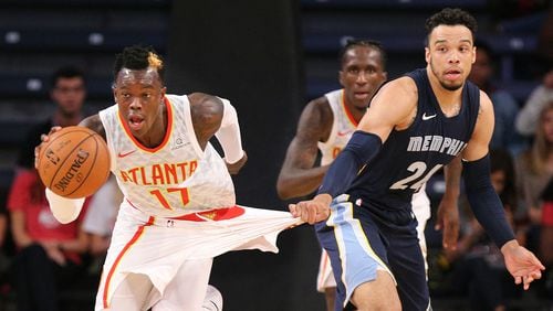 Hawks Dennis Schroder steals from Grizzlies Dillon Brooks during the first half in a NBA preseason basketball game on Monday, October 9, 2017, in Atlanta.   Curtis Compton/ccompton@ajc.com