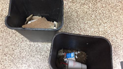 Garbage cans at Dresden Elementary School were moved to catch water from roof leaks. (Handout Photo)