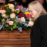 Amy Carter walks past the casket of her mother, former first lady Rosalynn Carter, after speaking at a tribute service for her mother at Glenn Memorial Church at Emory University on Tuesday, Nov. 28, 2023, in Atlanta. (Brynn Anderson/Pool/AFP/Getty Images/TNS)