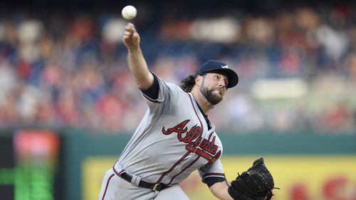 Braves starting pitcher R.A. Dickey delivers a pitch against the Washington Nationals. (AP Photo/Nick Wass)