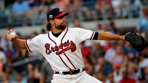 Atlanta Braves starting pitcher R.A. Dickey (19) works in the first inning of a baseball game against the Arizona Diamondbacks Friday, July 14, 2017, in Atlanta. (AP Photo/John Bazemore)