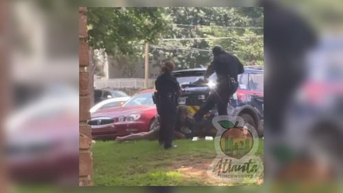 Two Atlanta police officers were suspended after a video surfaced on social media of one kicking a woman in the face as she lay handcuffed on the ground. Sgt. Marc Theodule was later fired.