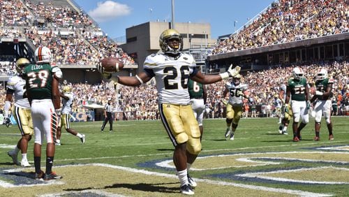 Georgia Tech Yellow Jackets running back Dedrick Mills (26) celebrates after he scored a touch in the first half at Bobby Dodd Stadium on Saturday, October 1, 2016. HYOSUB SHIN / HSHIN@AJC.COM