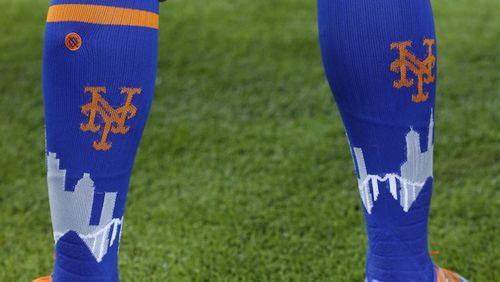 New York Mets center fielder Juan Lagares' socks are shown before the start of a baseball game against the Miami Marlins, Saturday, April 15, 2017, in Miami. (AP Photo/Wilfredo Lee)