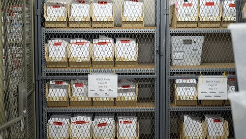 Rape kits -- typically a DNA swab in an envelope, with other evidence -- in the vault at the Georgia Bureau of Investigation last week. KENT D. JOHNSON/KDJOHNSON@AJC.COM