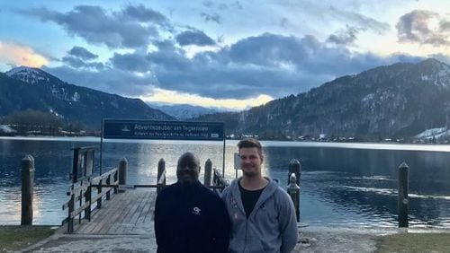 Georgia Tech assistant coach Mike Pelton poses with Tech commit Julius Welschof in front of Tegernsee, a lake in southern Germany near Welschof's home in Miesbach.