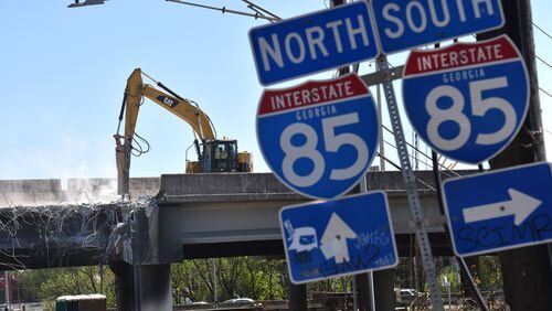 April 1, 2017 Atlanta - Crews demolish  damaged sections of I-85 bridge structures on Saturday, April 1, 2017. Necessary work is continuing on the damaged sections of I-85 bridge structures. This includes demolition of the existing failed and damaged structures - which includes two 350-foot sections of interstate, one section each in both the northbound and southbound lanes, totaling approximately 700 feet - as well as all reconstruction activities. HYOSUB SHIN / HSHIN@AJC.COM