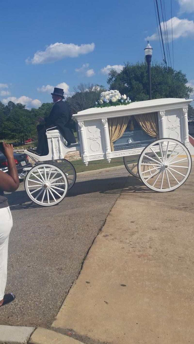Oliver "Poopoo" Campbell Jr.'s funeral procession was led by a white horse-drawn hearse. This photo was taken from a friend's Twitter account.