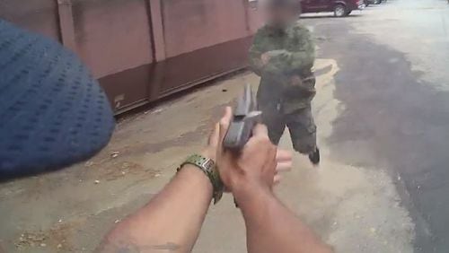 Body camera footage released in October shows the moment an officer fires at a machete-wielding suspect who lunged at him.